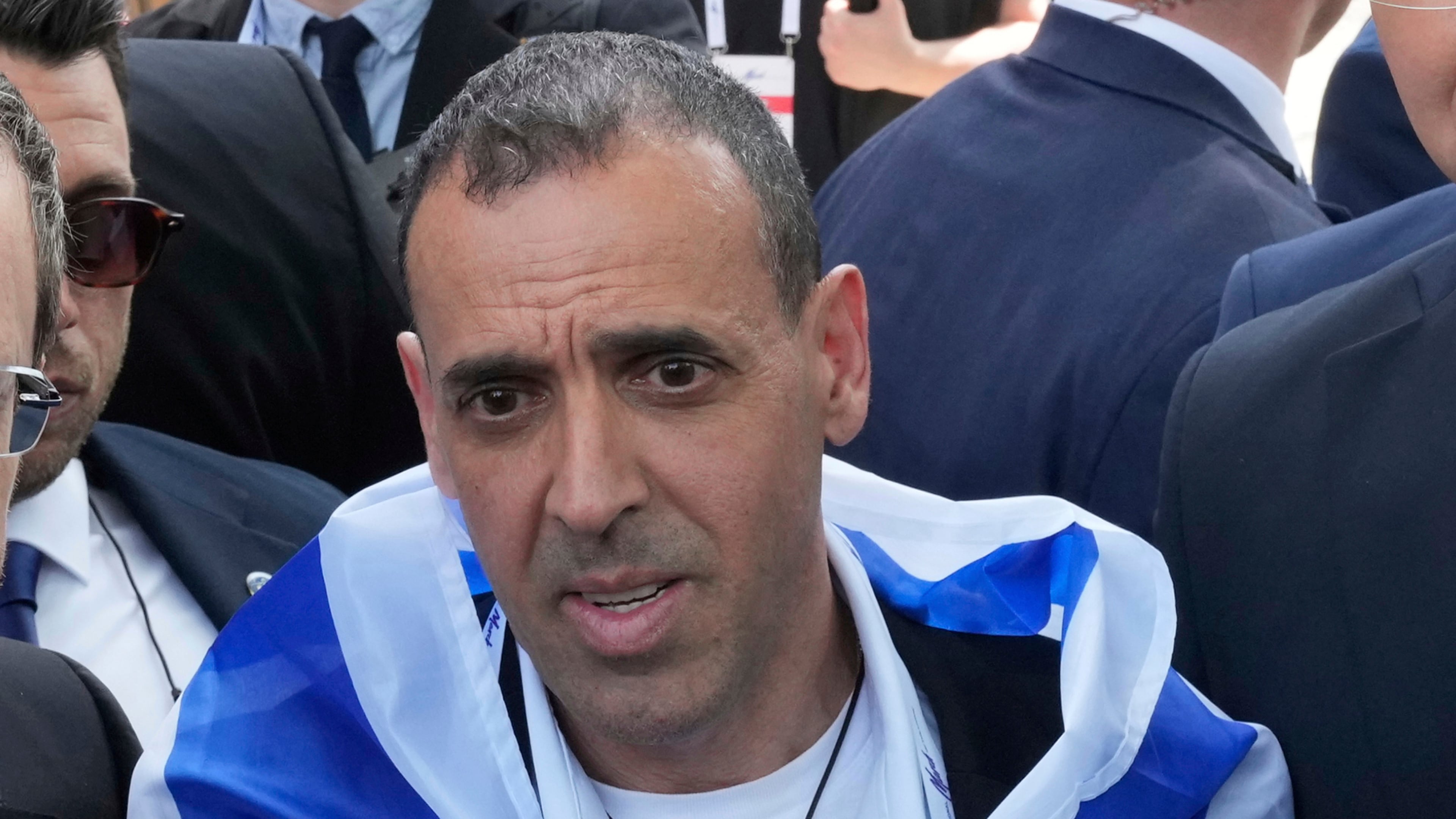 Eli Sharabi, a freed Israeli hostage, appears at a Holocaust remembrance event at Auschwitz-Birkenau State Museum in Poland on April 24, 2025. He'll appear at the Book Festival of the MJCCA Oct. 11 to discuss his memoir "Hostage." (Czarek Sokolowski/AP)