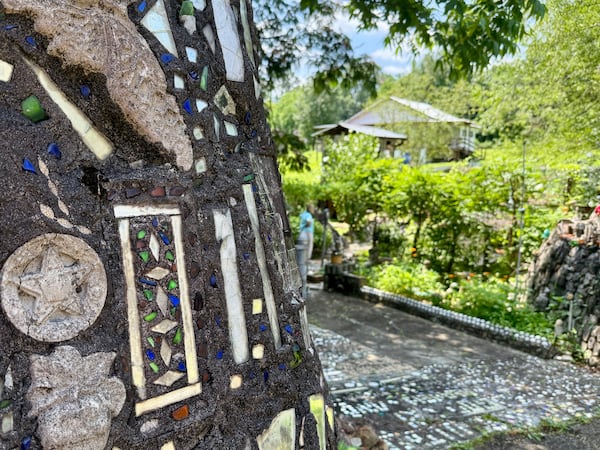 Howard Finster utilized all sorts of decorative concrete molds, pieces of shattered mirror and found objects to build walls and pathways throughout Paradise Garden. Danielle Charbonneau/AJC