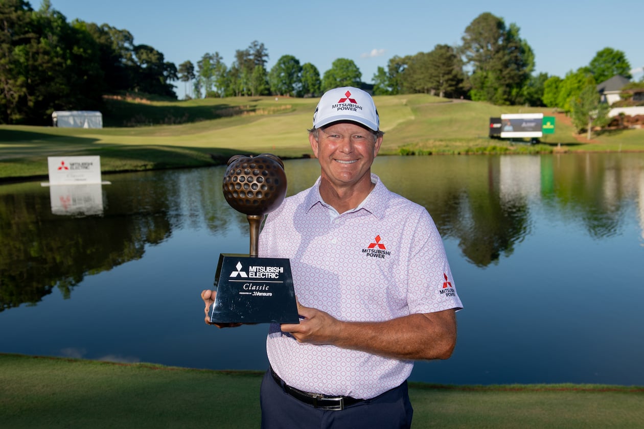 Retief Goosen holds the trophy for winning the Mitsubishi Electric Classic, April 26, 2026, at TPC Sugarloaf. Photo Kate Awtrey-King.