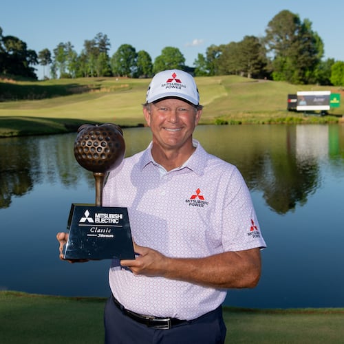 Retief Goosen holds the trophy for winning the Mitsubishi Electric Classic, April 26, 2026, at TPC Sugarloaf. Photo Kate Awtrey-King.