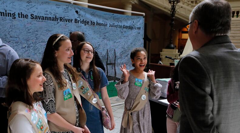 Girl Scouts from Troop 727 in Rome talk with Lt. Gov. Casey Cagle while they prepare for a press conference Monday. They joined other Girl Scouts in presenting more than 10,000 signatures that support renaming the Talmadge Memorial Bridge in Savannah after the Girl Scouts’ founder, Juliette Gordon Low. BOB ANDRES /BANDRES@AJC.COM
