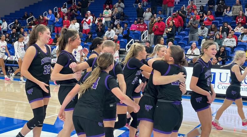 North Forsyth players celebrate their 43-33 victory over Veterans in the Class 6A girls basketball semifinals at the University of West Georgia Coliseum on March 2, 2024.