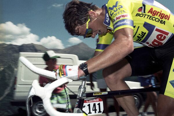FILE - Cyclist Greg LeMond of the United States is shown in action in the 15th stage of the Tour de France in town of Ocieres, in the French Alps, July 16, 1989. (AP Photo/Lionel Cironneau, File)