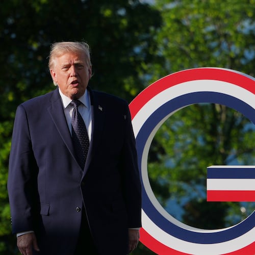 U.S. President Donald Trump talks as he greets France's President Emmanuel Macron and first lady Brigitte Macron at the G7 summit, Monday, June 15, 2026, in Evian-les-Bains, France. (AP Photo/Julia Demaree Nikhinson)