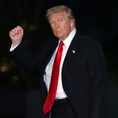 President Donald Trump gestures while walking across the South Lawn of the White House, Sunday, Nov. 2, 2025, in Washington, after returning from a trip to Florida. (AP Photo/Mark Schiefelbein)
