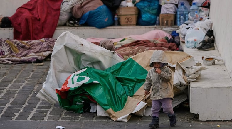 Displaced people fleeing Israeli airstrikes in Dahiyeh, Beirut's southern suburbs, sleep at Martyrs' Square in downtown Beirut, Lebanon, Saturday, March 7, 2026. (AP Photo/Bilal Hussein)