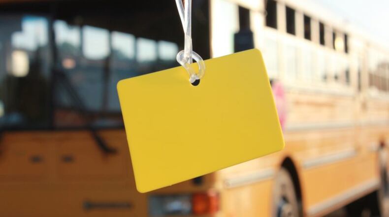 Children in Cobb schools may bring water containers on school buses only during August and September. Also, children, ages 8 and younger, must keep a plain yellow tag on their book bags throughout the school year for quicker identification by school bus staff. Courtesy of Cobb County School District