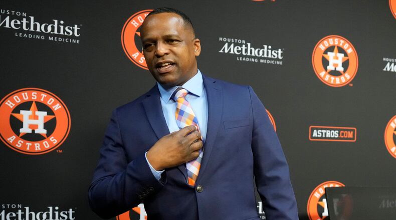 Dana Brown talks about the tie his wife picked out for him following a news conference after being hired as the Astros general manager Thursday, Jan. 26, 2023, in Houston. Brown replaces James Click, who was not given a new contract and parted ways with the Astros just days after they won the World Series. (AP Photo/David J. Phillip)