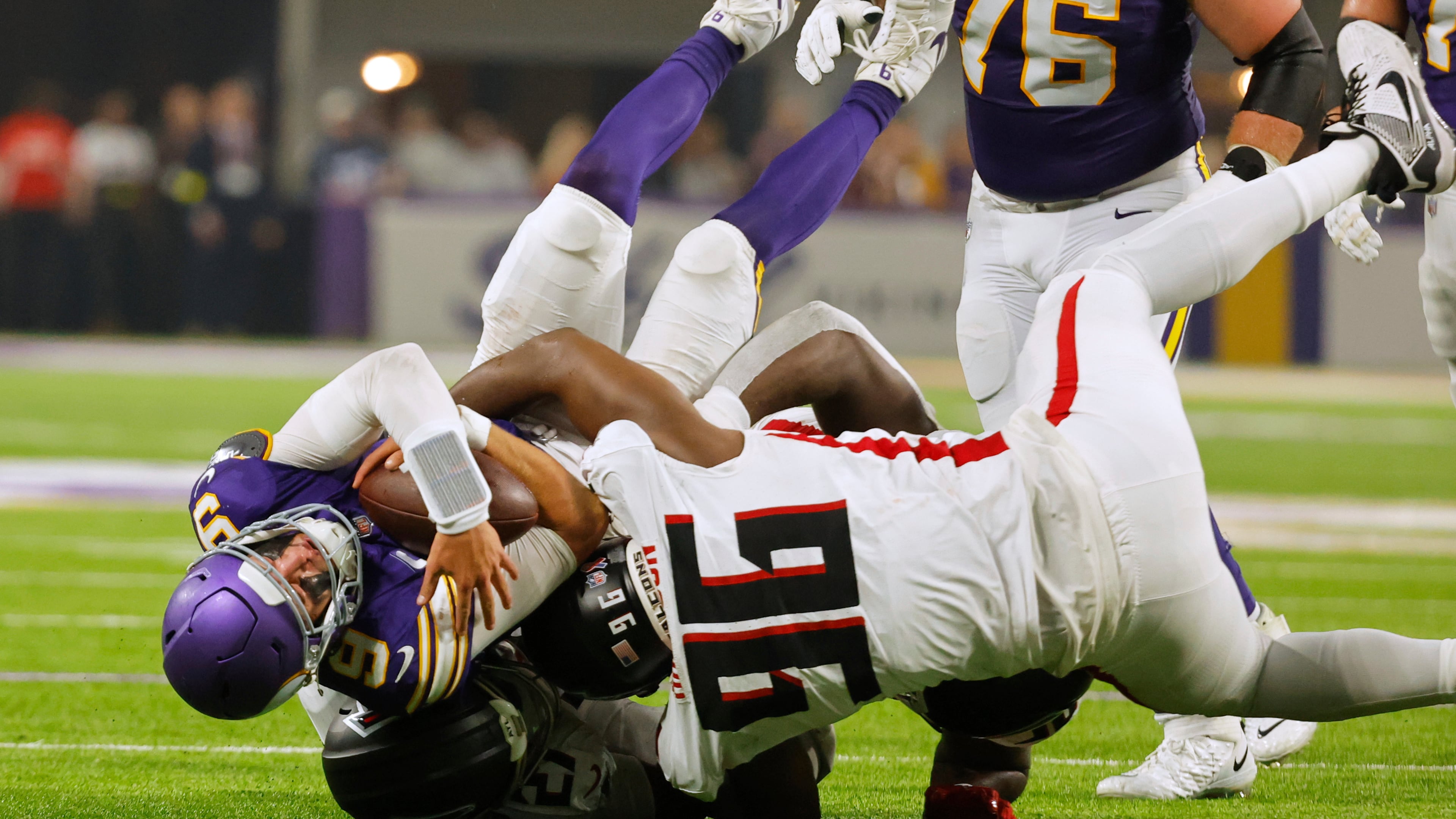Atlanta Falcons defensive end Zach Harrison (96) sacks Minnesota Vikings quarterback J.J. McCarthy (9) during the first half of an NFL football game, Sunday, Sept. 14, 2025, in Minneapolis. (AP Photo/Bruce Kluckhohn)