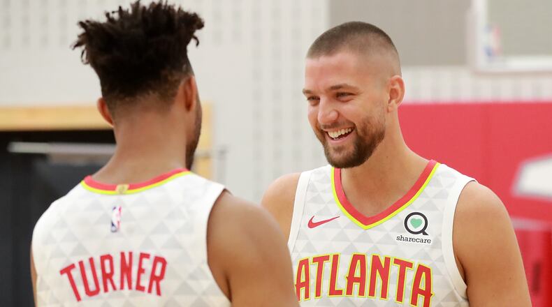 Atlanta Hawks guard Evan Turner (left) and forward Chandler Parsons share a laugh during media day on Monday, Sept. 30, 2019, in Atlanta.    Curtis Compton/ccompton@ajc.com