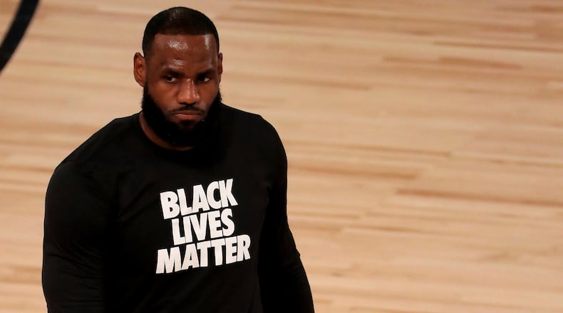 Los Angeles Lakers' LeBron James wears a Black Lives Matter shirt as he takes to the court prior to game against the Los Angeles Clippers, Thursday, July 30, 2020, in Lake Buena Vista, Fla. (Mike Ehrmann/AP)