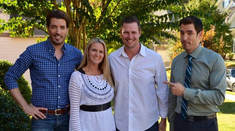 Melissa and Joe Durham (middle) pose with Property Brothers Jonathan Scott (left) and Drew Scott (right). (Courtesy Melissa Durham)