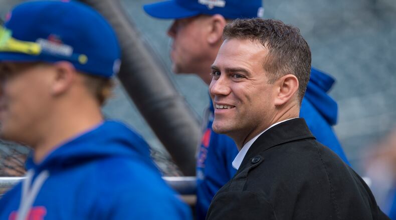 Theo Epstein, the president of baseball operations for the Chicago Cubs, watches the team work out a day before the start of the National League Championship Series against the Mets, at Citi Field in New York, Oct. 16, 2015. Epstein’s reputation as a miracle worker from the Red Sox’ World Series win will be tested by the Cubs’ own infamous streak. (Ben Solomon/The New York Times)