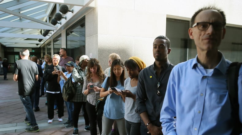 October 17, 2016 - Atlanta - The line for voting extends out of the building at the Fulton County Government Center where the first day of early voting had begun. BOB ANDRES /BANDRES@AJC.COM