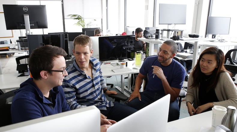 Handshake co-founder Garrett Lord, second from left, works with software developers, Thursday, Sept. 14, 2017, at the company’s office in San Francisco, Calif., on an app that helps college graduates find jobs. (Karl Mondon/Bay Area News Group/TNS)