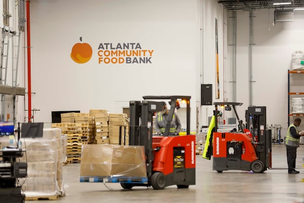 Workers load food at the Atlanta Community Food Bank on Wednesday, October 29, 2025.(Miguel Martinez/AJC)