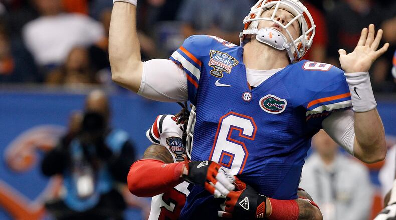 Louisville safety Calvin Pryor (25) causes Florida quarterback Jeff Driskel (6) to fumble the ball during the second half of the Sugar Bowl NCAA college football game Wednesday, Jan. 2, 2013, in New Orleans. Louisville recovered and scored on the next play. (AP Photo/Butch Dill)
