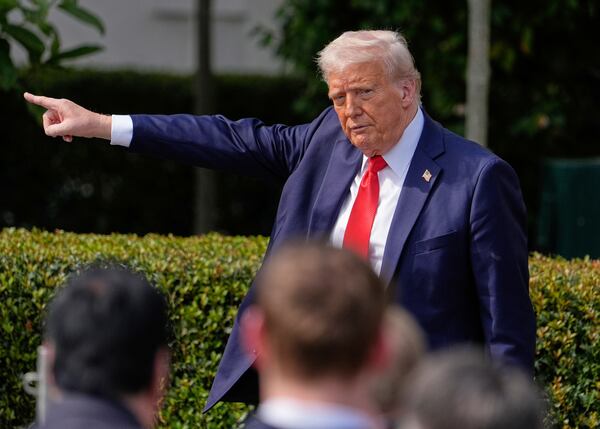 President Donald Trump gestures after welcoming the 2025 College Football National Champions, the Ohio State University football team, to the White House on Monday.