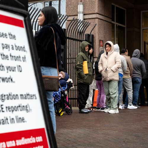 People line up outside the federal building in Atlanta that houses an immigration court and ICE office. Several cases in the court are at the center of a disciplinary proceeding against Norcross immigration lawyer Christopher Taylor. (Ben Hendren/AJC 2025)