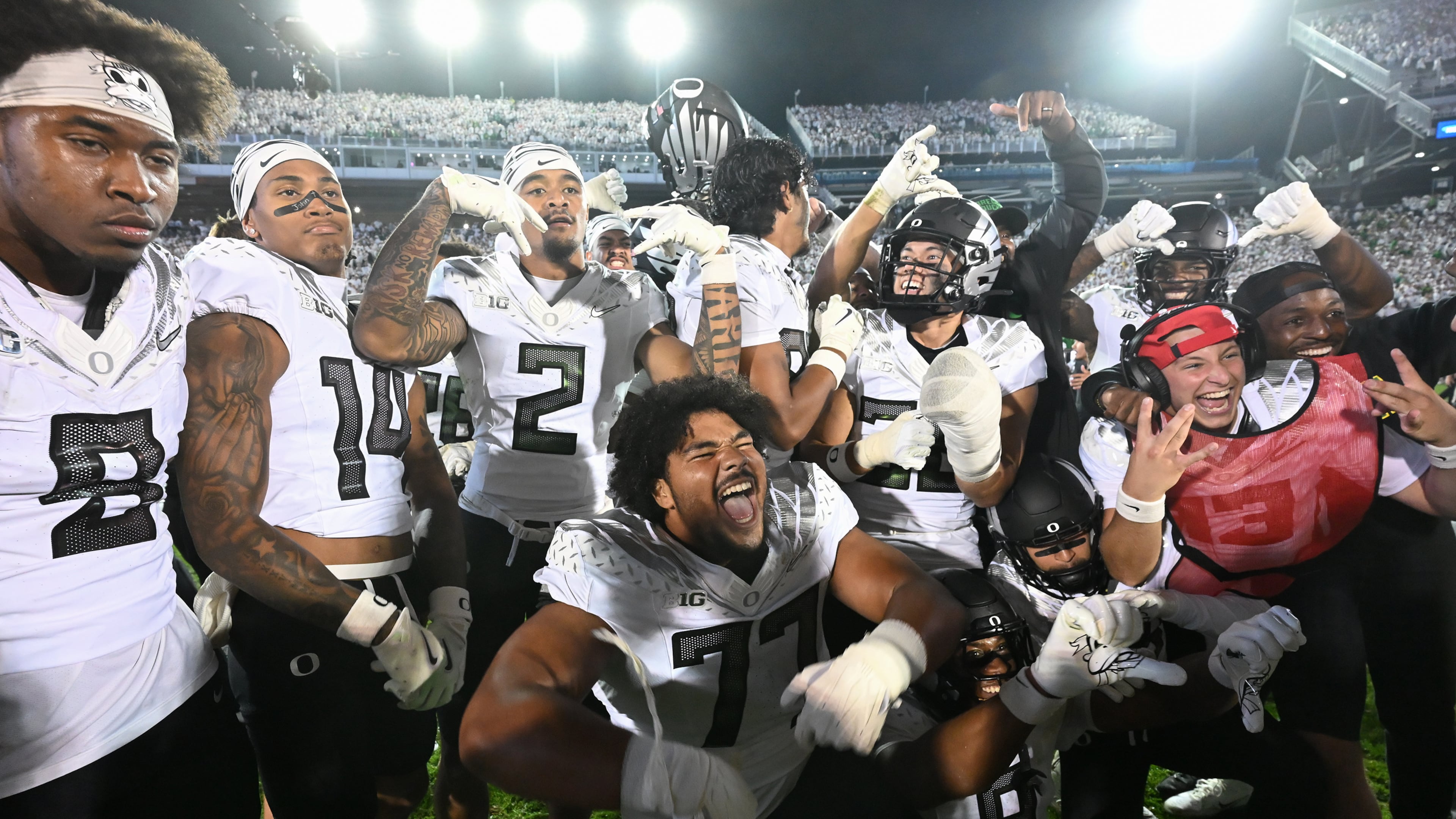 Oregon players celebrate their second overtime win over Penn State during their NCAA college football game, Saturday, Sept. 27, 2025, in State College, Pa. (AP Photo/Barry Reeger)