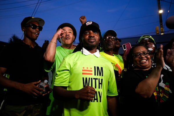 District of Columbia councilmember elect Trayon White, center, pumps his fist as he arrives to his Ward 8 special election watch party, Tuesday, July 15, 2025, in Washington. (AP Photo/Julia Demaree Nikhinson)