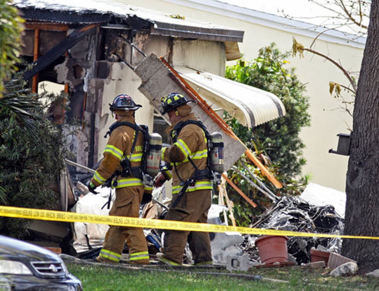 Plane crashes into house