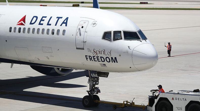 A Delta airlines plane on the tarmac of the Fort Lauderdale-Hollywood International Airport on July 14, 2016 in Fort Lauderdale, Florida. The airline is being solicited by other states after Georgia officials threatened a $50 million sales tax break because Delta ended a NRA discount.