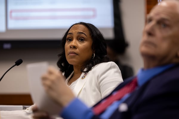 Fulton County District Attorney Fani Willis, is shown next to her attorney, former Gov. Roy Barnes, on Wednesday, December 17, 2025. (Arvin Temkar/AJC)