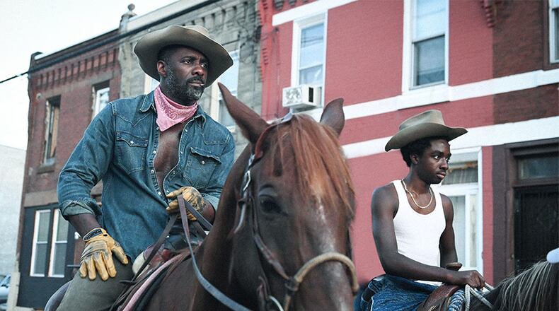 Idris Elba (left) stars in a new film about Black cowboys called "Concrete Cowboy" on Netflix. NETFLIX