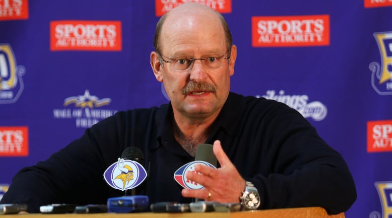 Former Minnesota Vikings head coach Brad Childress answers questions from the media during a press conference in 2010.