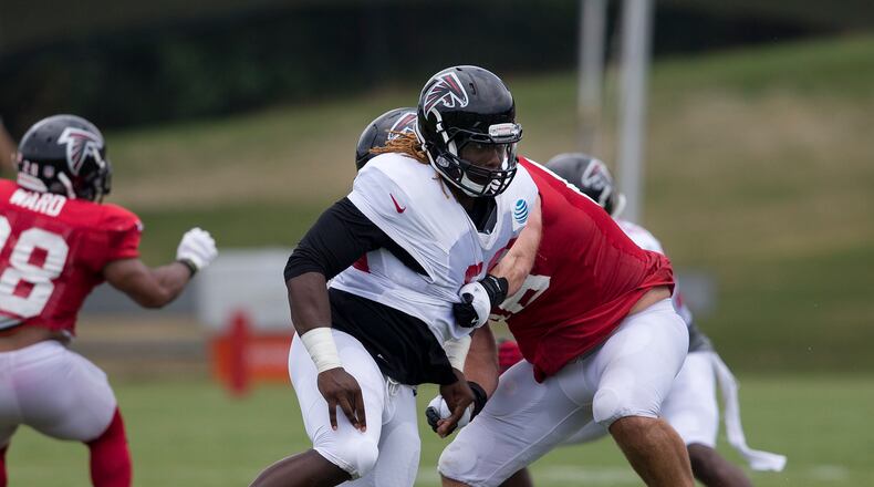 Rookie defensive end Takk McKinley (left) works against offensive tackle Kevin Graf (66) during Wednesday's training camp practice.