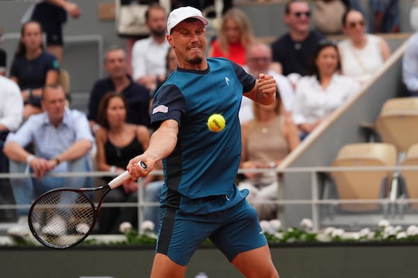 Austria's Filip Misolic returns the ball to Serbia's Novak Djokovic during their third round match of the French Tennis Open, at the Roland-Garros stadium, in Paris, Saturday, May 31, 2025. (AP Photo/Lindsey Wasson)