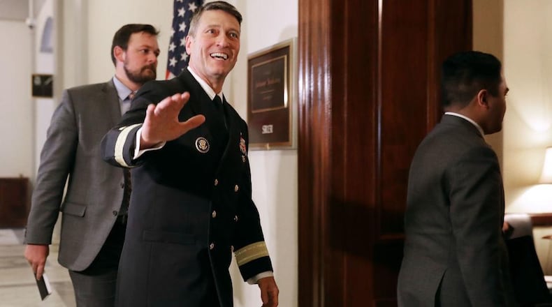 Physician to the president U.S. Navy Rear Admiral Ronny Jackson waves to journalists as he heads into a meeting with Senate Veterans Affairs Committee Chairman Johnny Isakson (R-GA) in the Russell Senate Office Building on Capitol Hill April 16, 2018 in Washington, DC.