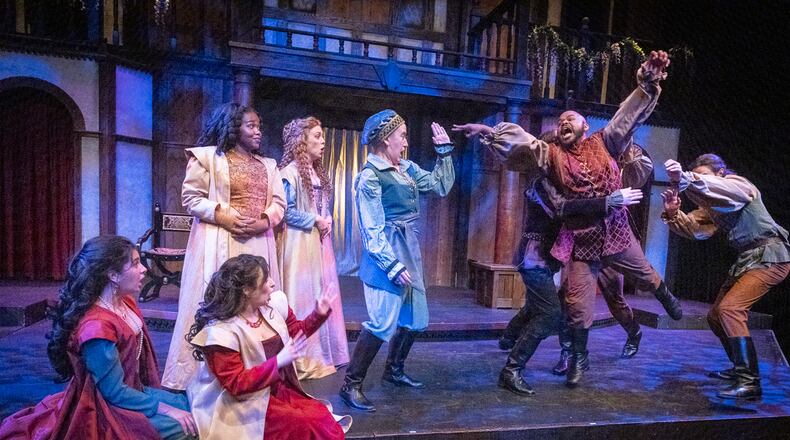 An animated O’Neil Delapenha (with arms raised) as Berowne and the cast of Shakespeare Tavern Playhouse's "Love's Labour's Lost."