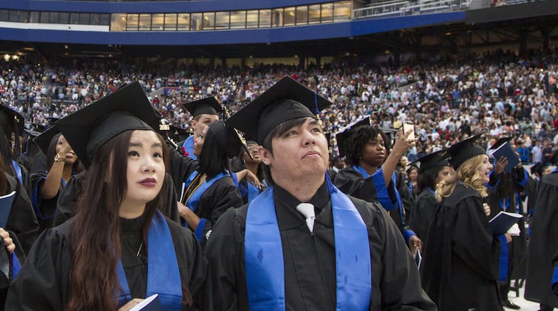 Georgia State University undergraduate students take part in the 2018 commencement ceremony at Georgia State Stadium in Atlanta on May 10, 2018. Georgia State has the largest enrollment of any school in the state. REANN HUBER / REANN.HUBER@AJC.COM