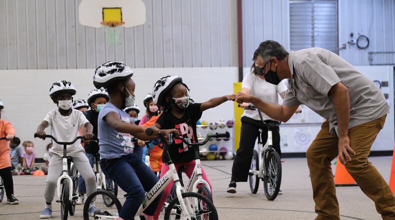 Students at Barksdale Elementary try out the school's recent gift of 24 new bikes. The donation also came with helmets and a curriculum to teach riding basics.
