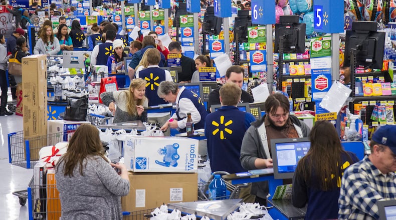 Shoppers purchase items for the holidays.