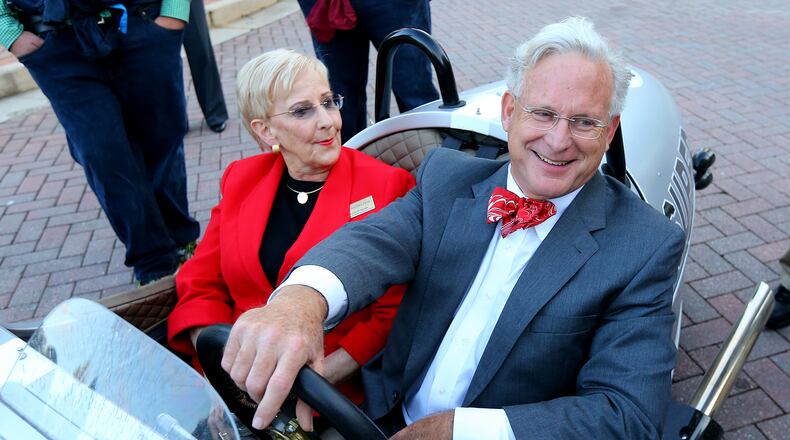 First Lady of Georgia Sandra Deal catches a ride with Roswell Mayor Jere Wood in his 3-wheel Morgan to another nearby campaign stop after her husband Georgia Governor Nathan Deal makes campaign stop with New Jersey Governor Chris Christie at Roswell City Hall on Thursday, Oct. 16, 2014, in Roswell. (CURTIS COMPTON / CCOMPTON@AJC.COM AJC File Photo)
