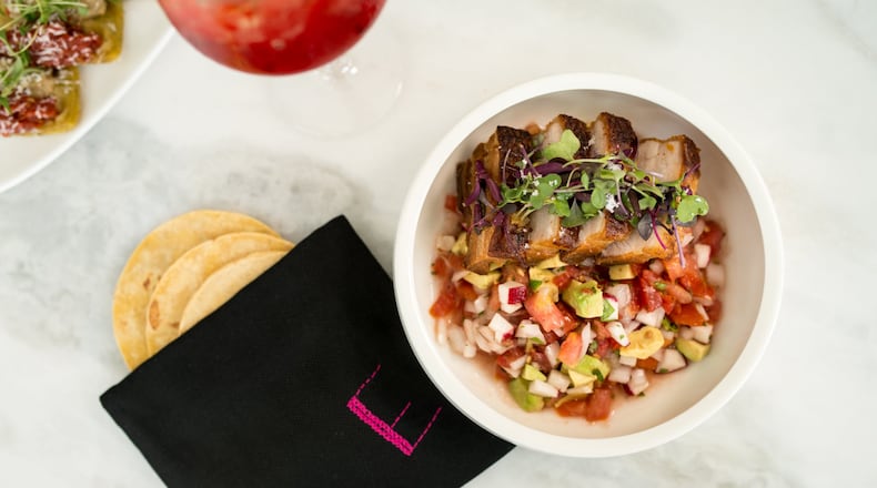 Estrella Yucatecan Pork Belly with radish pico, avocado puree, and corn tortillas. Photo credit - Mia Yakel.