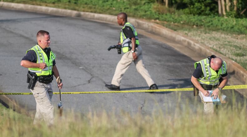 The bizarre series of events began Wed., May 11, 2016, on Cobb Parkway near Bells Ferry Road in Cobb County, where a woman hit and killed a pedestrian, Cobb police Officer Alicia Chilton said. JOHN SPINK / JSPINK@AJC.COM