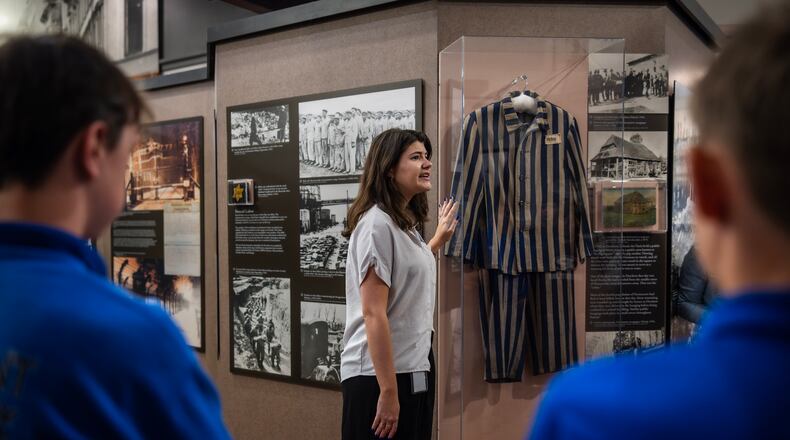 The docent Ariana Gil speaks to a school group from Monticello, Ga., at the Breman, a Holocaust museum in Atlanta, April 17, 2024. (Audra Melton/The New York Times)