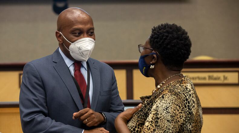 Calvin Watts speaks to a visitor after being confirmed as the Gwinnett County school district's new superintendent by the board of education on July 30, 2021 at the J. Alvin Wilbanks Instructional Support Center in Suwanee, Georgia, on July 30, 2021. (Rebecca Wright for the Atlanta Journal-Constitution)
