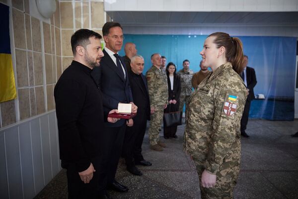 In this photo provided by the Ukrainian Presidential Press Office, NATO Secretary General Mark Rutte watches as Ukraine's President Volodymyr Zelenskyy awards a military medic with a state award in a hospital in Odesa, Ukraine, Tuesday, April 15, 2025.(Ukrainian Presidential Press Office via AP)
