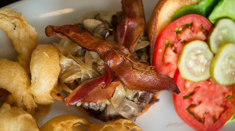 With a juicy patty, perfectly crisped bacon, two cheeses and a thick onion ring, the BCB burger at Peach & the Porkchop didn’t need a single condiment. (George Miko)