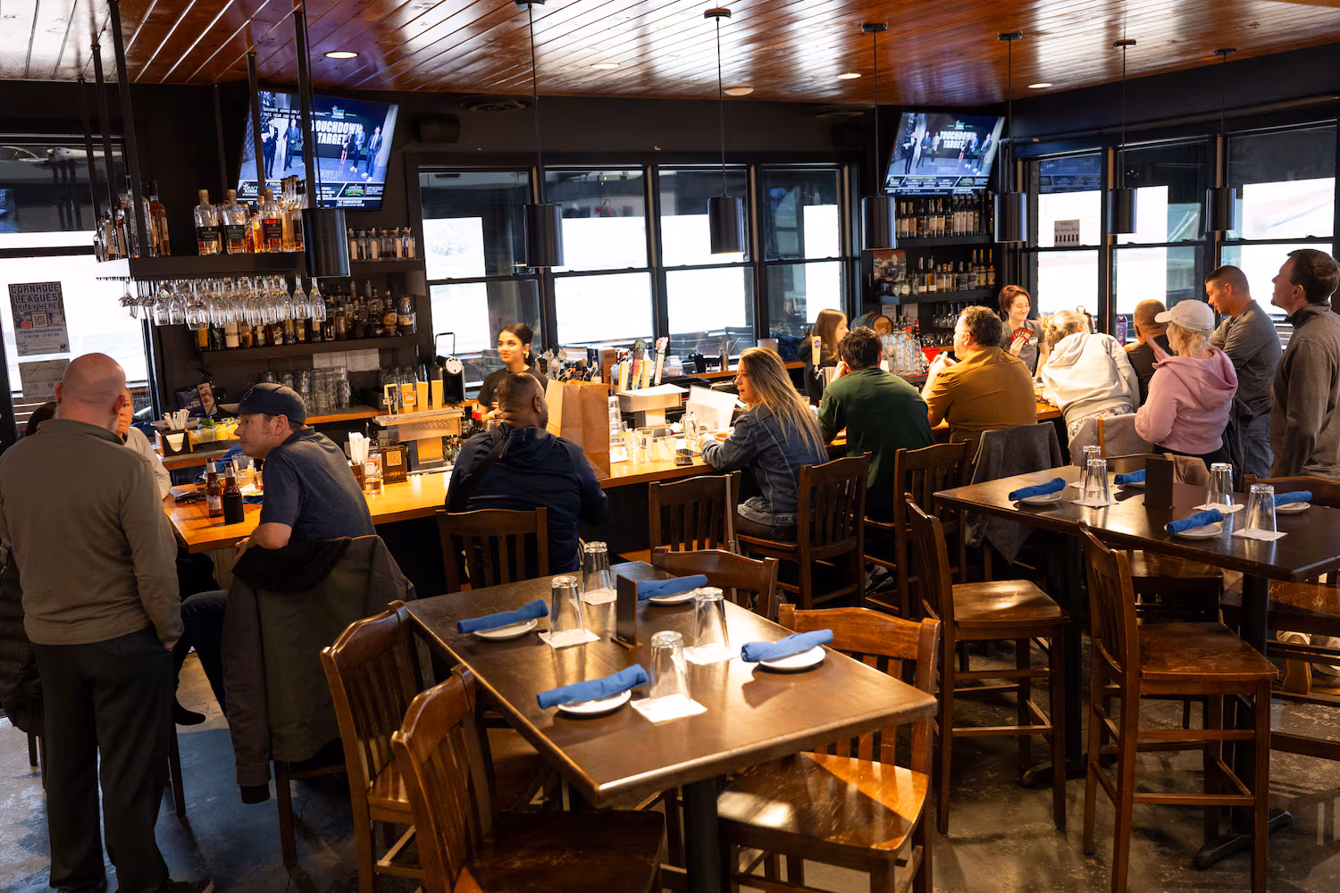 Patrons take shelter from the cold and rainy weather in the bar area of 1885 Grill in downtown Acworth Sunday, Jan. 25, 2025. (Daniel Varnado/For the Atlanta Journal-Constitution)