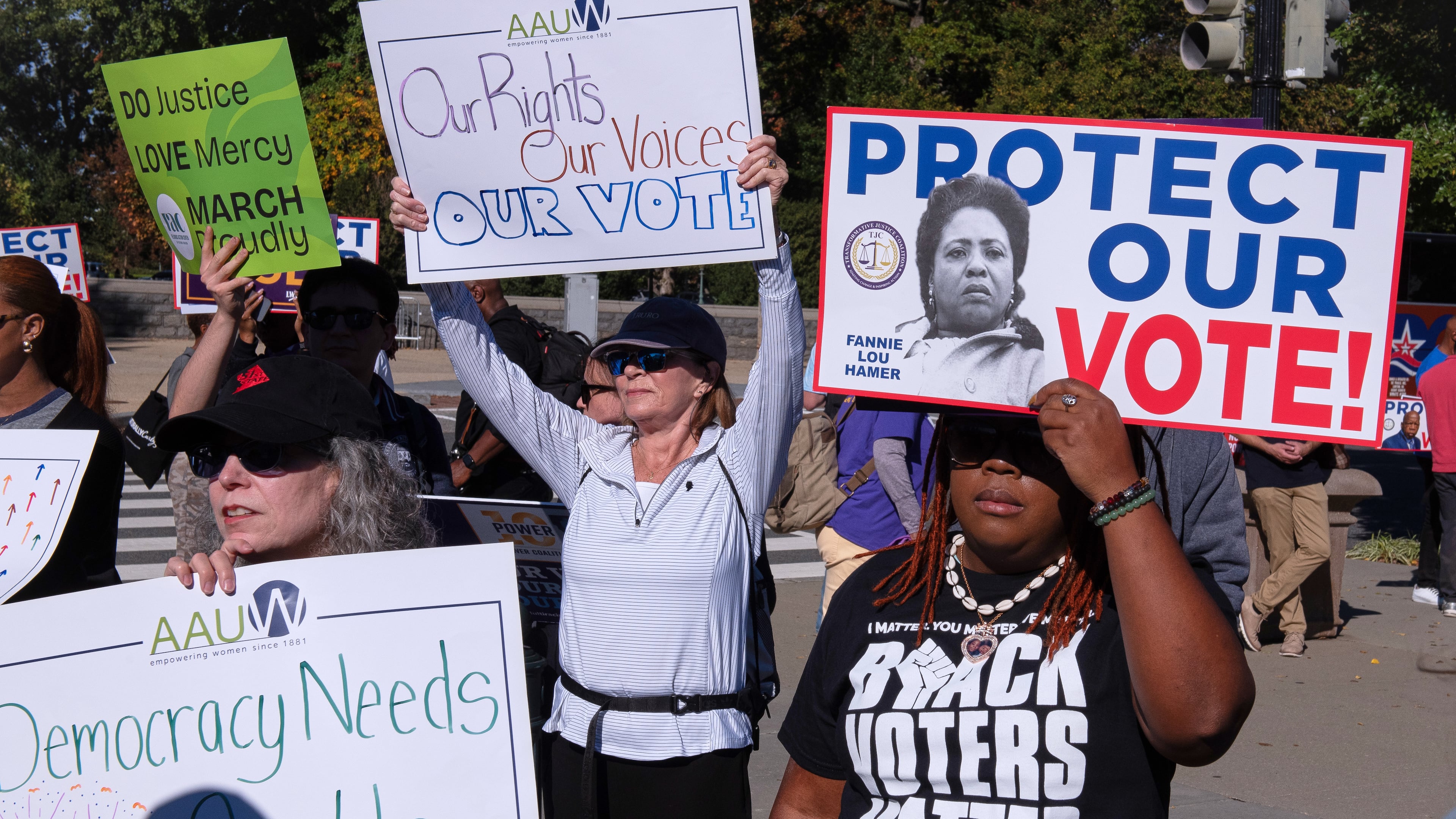 Voting rights activists gather outside the Supreme Court in Washington, early Wednesday, Oct. 15, 2025, as the justices prepare to take up a major Republican-led challenge to the Voting Rights Act, the centerpiece legislation of the Civil Rights Movement. (Cliff Owen/AP)