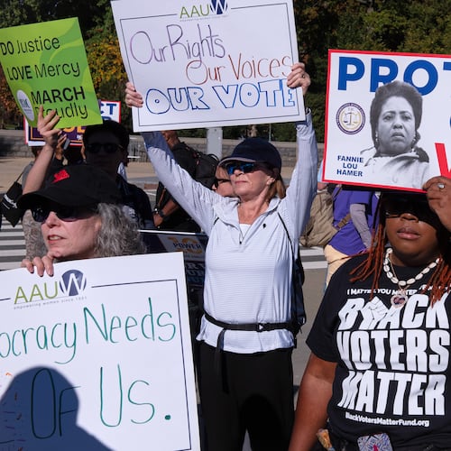 Voting rights activists gather outside the Supreme Court in Washington, early Wednesday, Oct. 15, 2025, as the justices prepare to take up a major Republican-led challenge to the Voting Rights Act, the centerpiece legislation of the Civil Rights Movement. (Cliff Owen/AP)