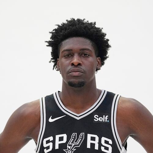 FILE - San Antonio Spurs center Charles Bediako poses for photos during an NBA basketball media day in San Antonio, Oct. 2, 2023. (AP Photo/Eric Gay, File)