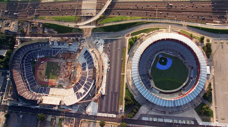 A scene from September 1996: Olympic Stadium, which would become Turner Field, on the left and Atlanta-Fulton County Stadium, which would be demolished, on the right. (AJC file photo/Joe McTyre)