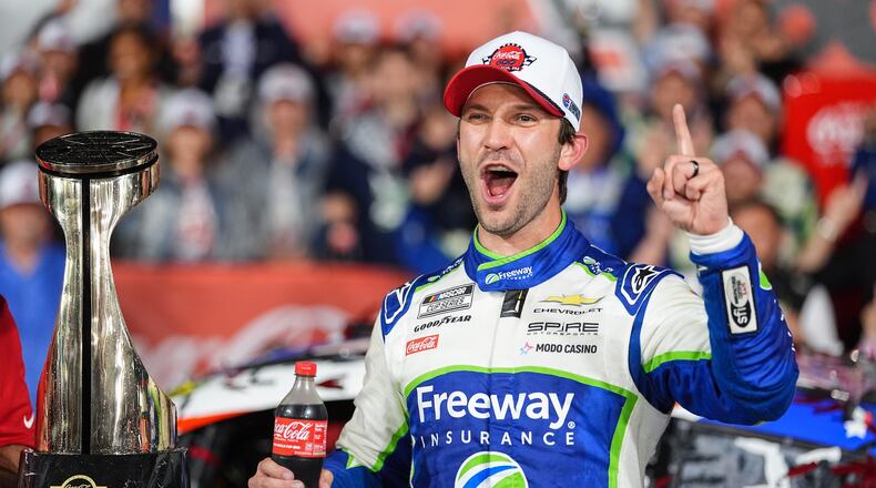 Daniel Suarez celebrates in Victory Lane after winning a NASCAR Cup Series auto race, Sunday, May 24, 2026, in Charlotte, N.C. (AP Photo/Matt Kelley)